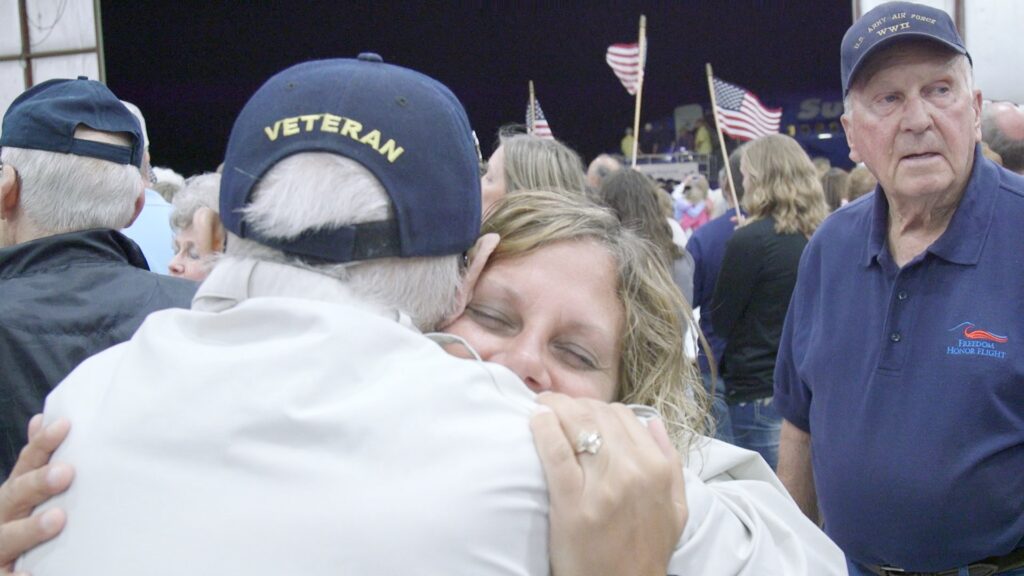 woman hugging veteran